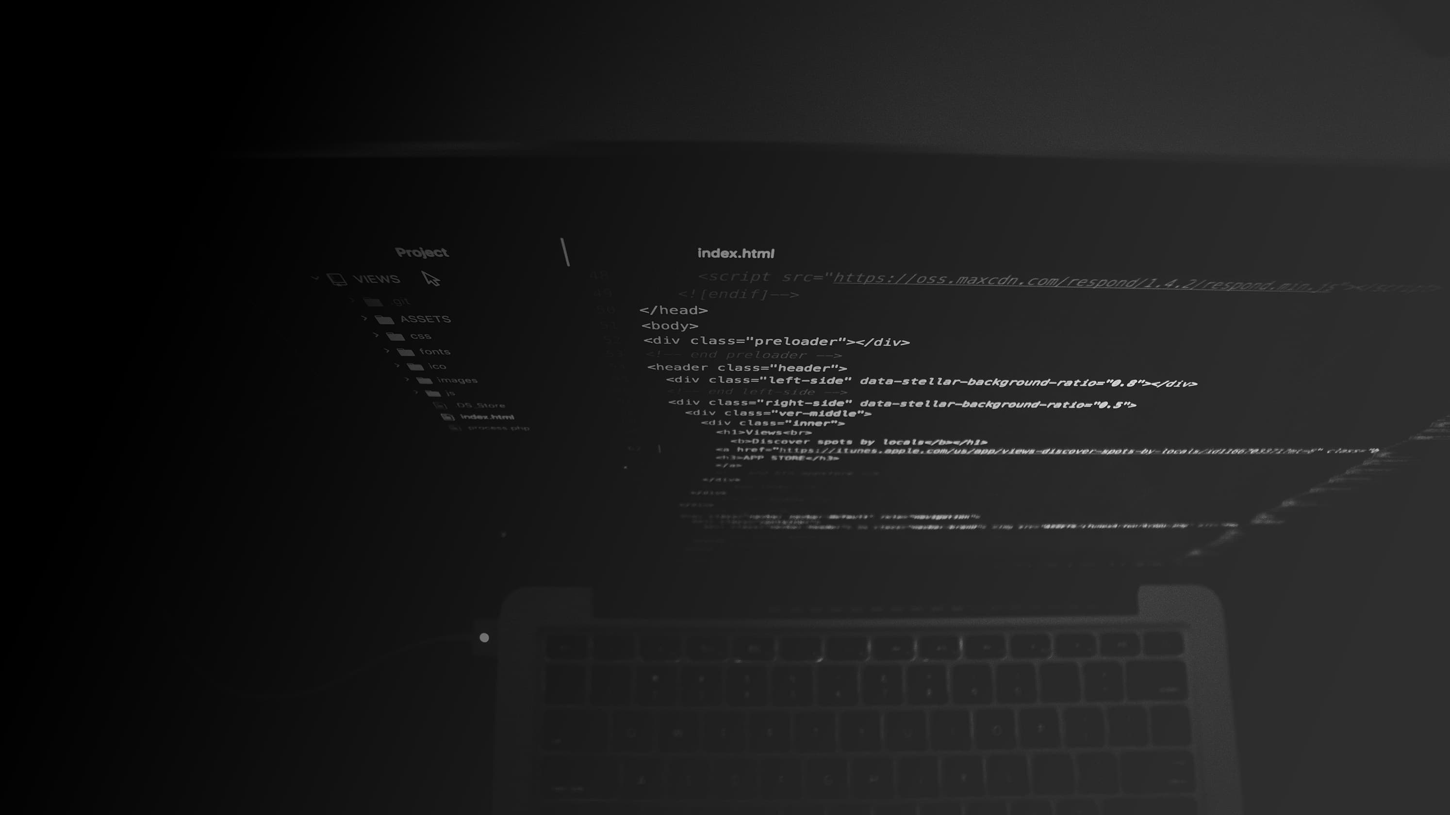 A laptop computer with code on the screen